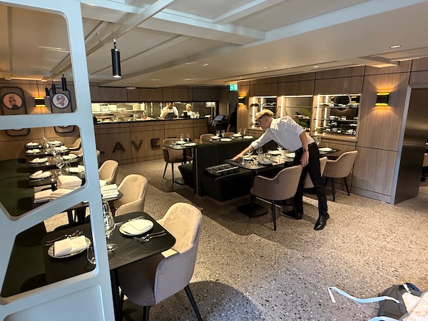 A member of staff setting the table in Lavera Restaurant
